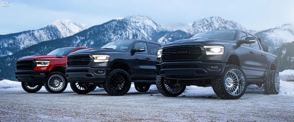 Three Ram 1500s on GT Off-Road Strike wheels in the mountains